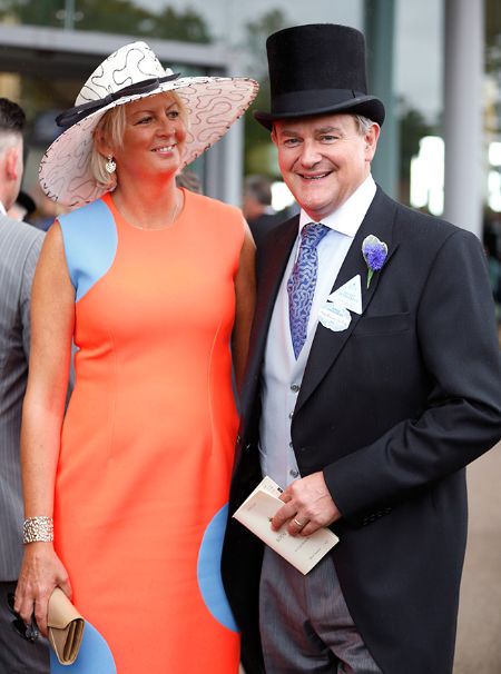 Hugh Bonneville in a black suit poses a picture with wife Lucinda 'Lulu' Evans.